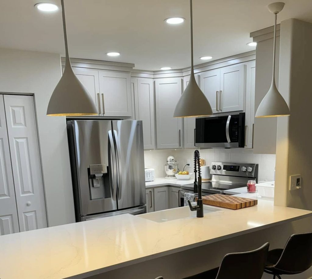 Gallery 48 Finished kitchen remodel with pendant lights, recessed lighting, and island outlets