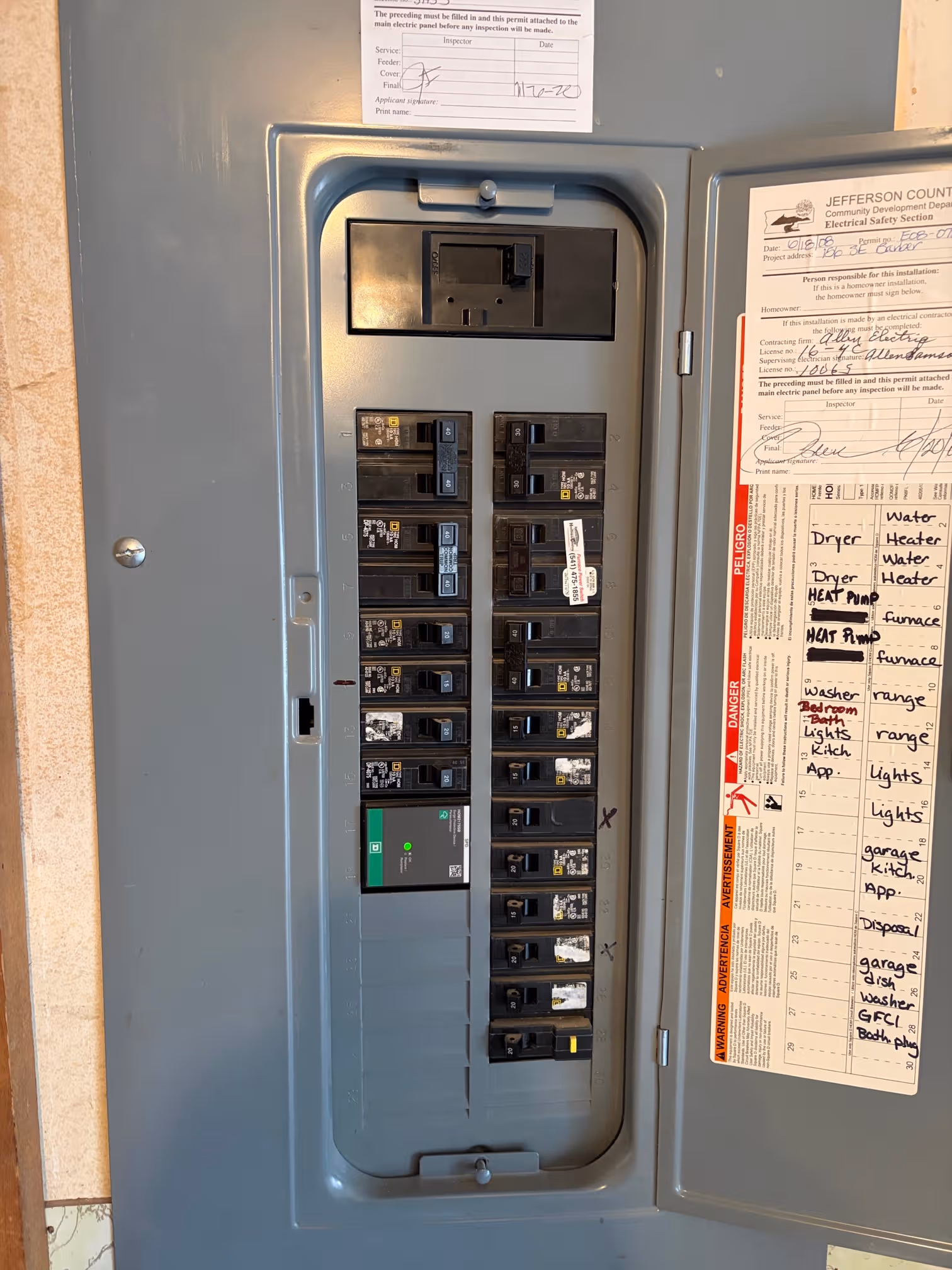 Whole-home surge protection device installed at a residential electrical panel
